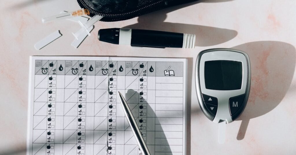 Close-up of a diabetes monitoring kit with glucometer, pen, and test strips on a table.